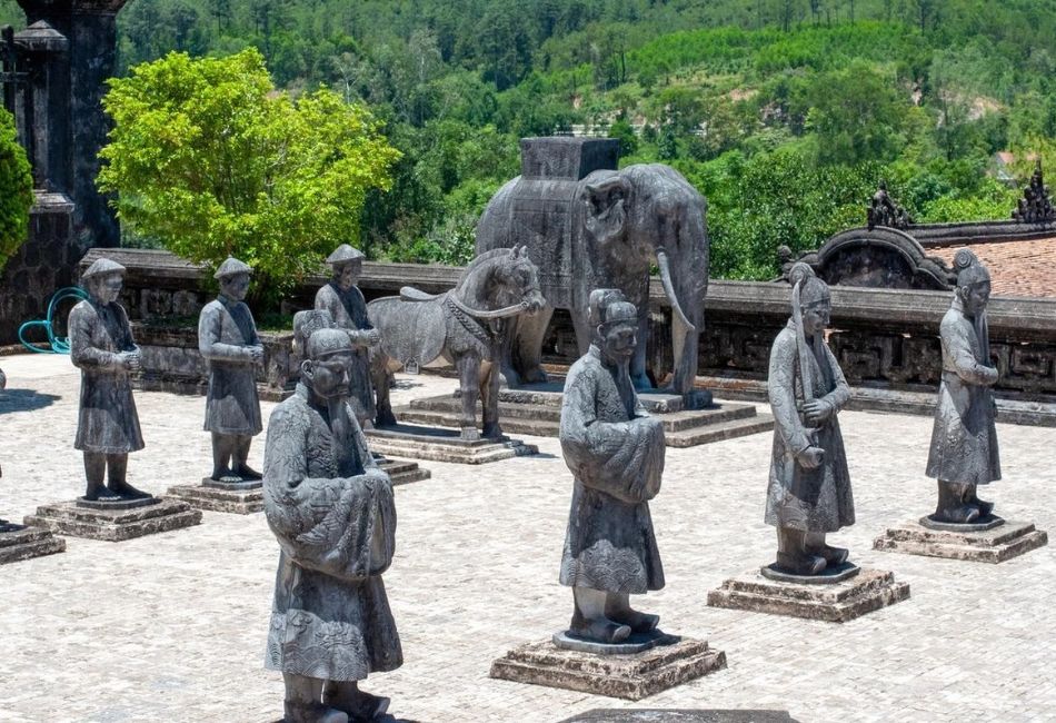 Stone mandarins, horses and elephants stand in the Honour Courtyard.